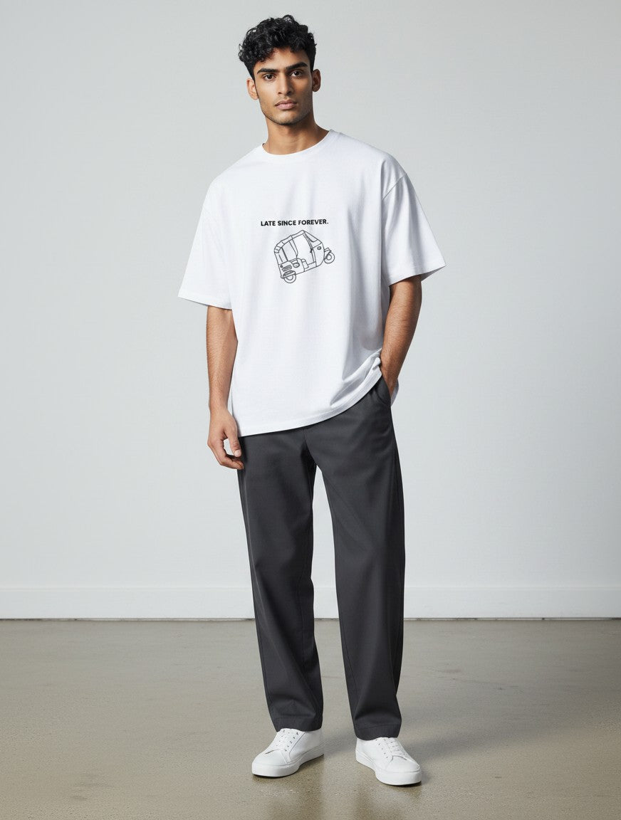 Model wearing a white mi-DONE oversized cotton t-shirt with a black rickshaw graphic and Late Since Forever text.