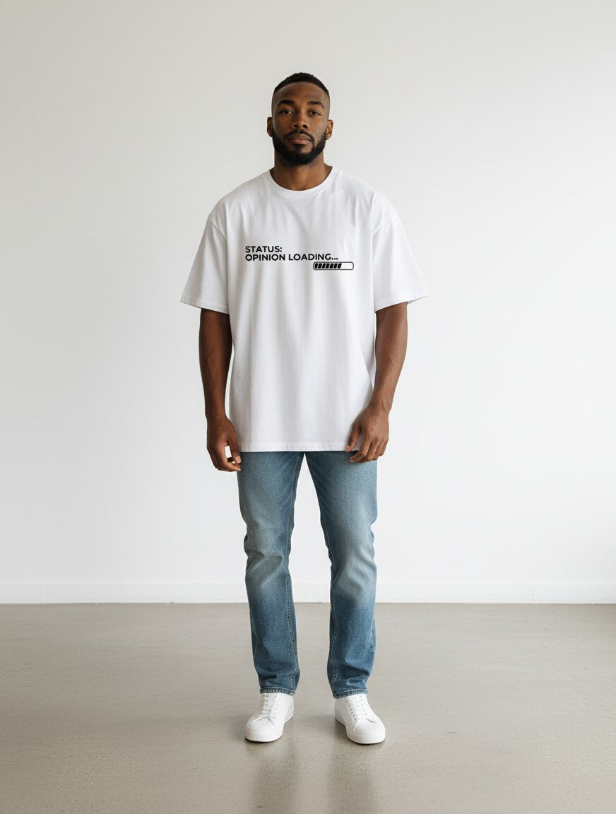mi-DONE white oversized cotton t-shirt with Opinion Loading graphic print worn by a man with blue jeans