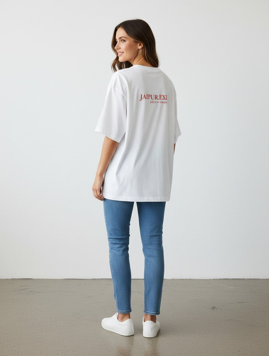 A woman wearing a white mi-DONE oversized cotton t-shirt with red text on the back, paired with blue jeans.