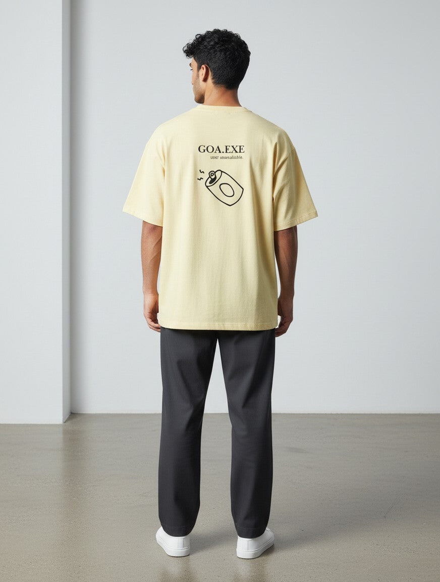 mi-DONE oversized yellow cotton t-shirt with Goa graphic print on back, worn by a man with dark trousers